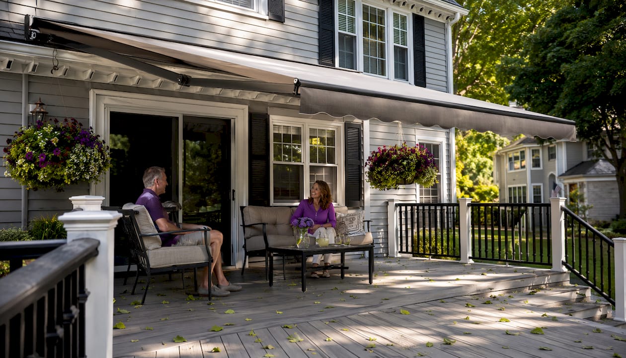 Suburban colonial home with extended retractable awning