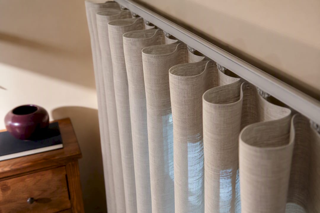 Full ripplefold drapery on wide window