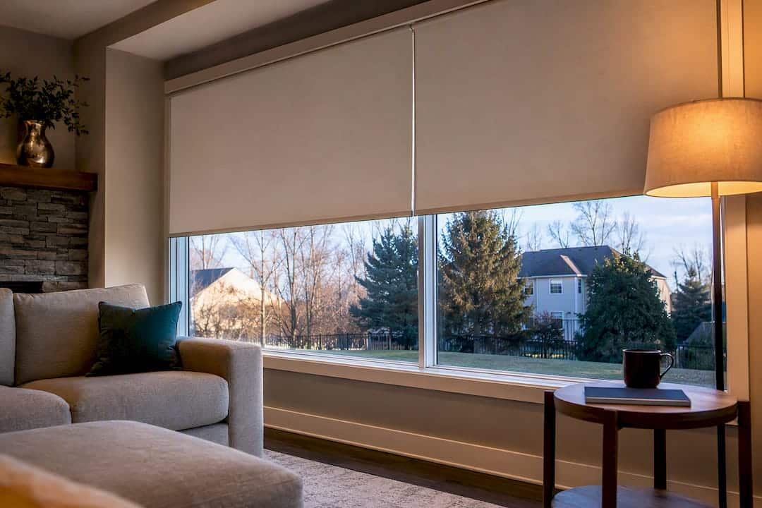 Aligned roller shades across a wide window