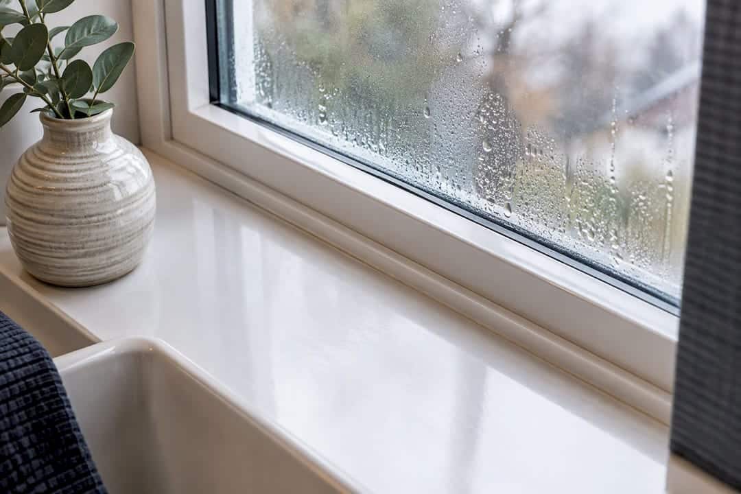 Bathroom window condensation on water-resistant trim
